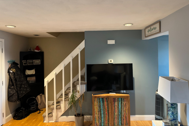 Living room with new pull out couch with storage and flat screen television - Beautiful town house close to URI campus