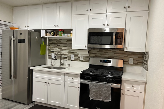 kitchen with stainless steel appliances, instant hot water dispenser/soap dispenser - Rent discount for graduate student and faculty! Quiet and modern unit.  Close to Riverside Pl