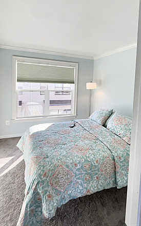 Private bedroom with adjustable queen bed and soft natural light. - Flexible Lease Options - Private Top-Floor Suite with Loft & Rooftop Terrace in Shared Townhome