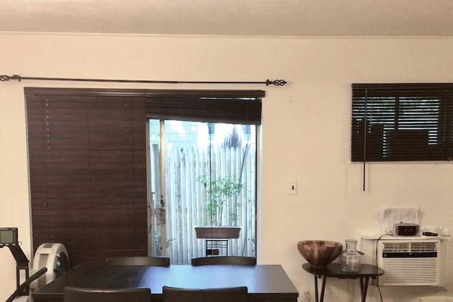 Dining Rm/Living Rm, facing patio - 1 Bedroom Condo betw COOLIDGE CORNER & LMA Area. SUPER CONVENIENT, INCLUDES PRIVATE PARKING. NO FEE.