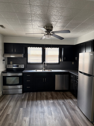 Marvelously updated kitchen opens to breakfast nook. - Pretty three bedroom one bath home on quiet street in a great location!