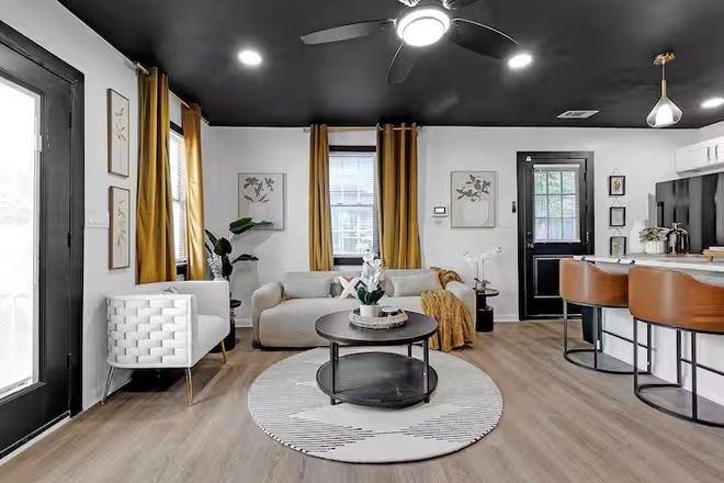 Living Room and kitchen open area - Zoe's Hideout (Fully Furnished w/ washer & dryer in unit and driveway parking)