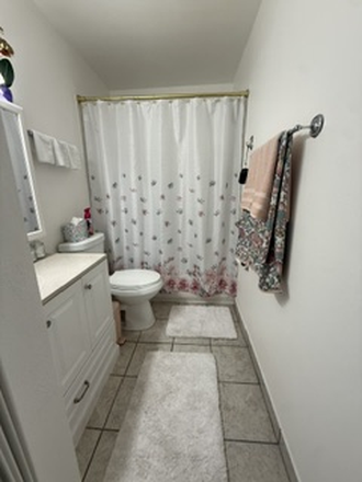Bathroom with hot and cold running water, ample storage space, and a clean, comfortable setup - Cozy Private Room Near Denver – Utilities Included Condo