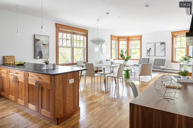 Open floor plan with hardwood floors - Sunny, spacious condo