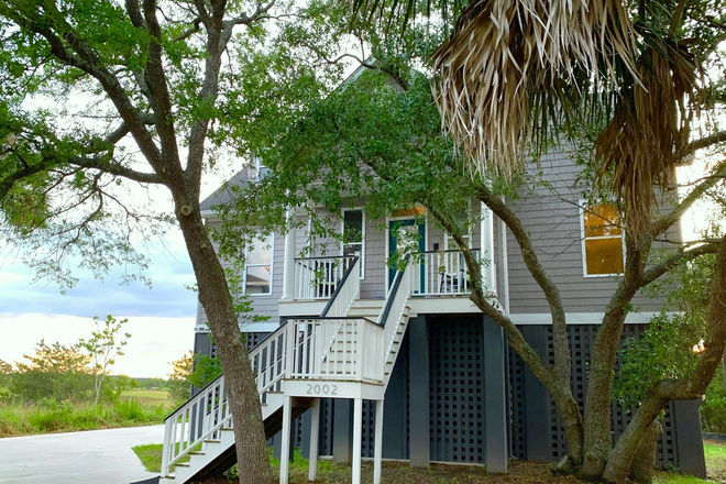 Front porch. Garage space on first level. - Private Floor Between Downtown and Folly Beach Marshfront House