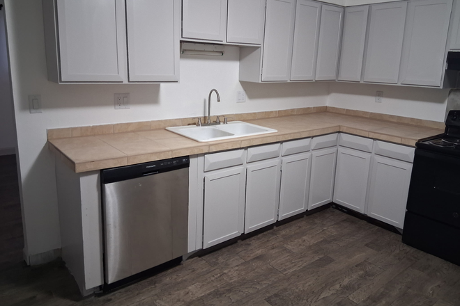 Kitchen dishwasher and refrigerator - 2 Bedroom 1 Bathroom Garden Level unit
