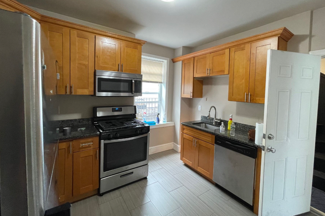 Kitchen - September 1! 4 bed available on Maverick St. right down the street from the T! Apartments