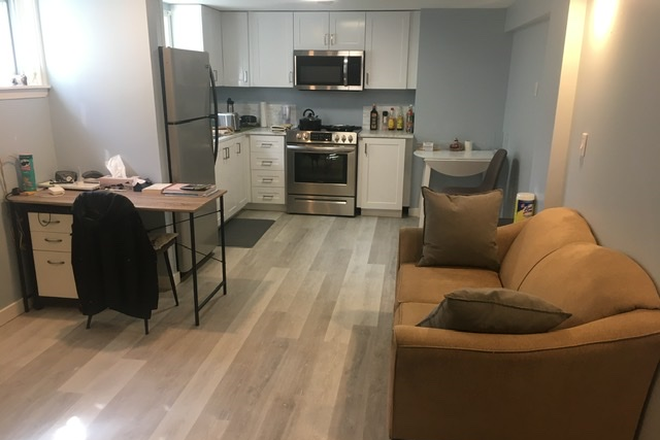 Kitchen and Living with TV - 1 Basement Unit available- -private/safe-Newly Renovated-with parking