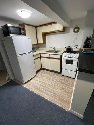 Kitchen - Furnished English basement for rent in historic Brookland house. Walk to metro and  CUA