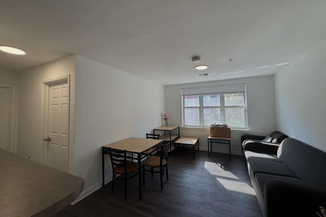Living room - South Campus Commons. Bedroom, Bathroom, Kitchen, Laundry, Living Room. Apartments