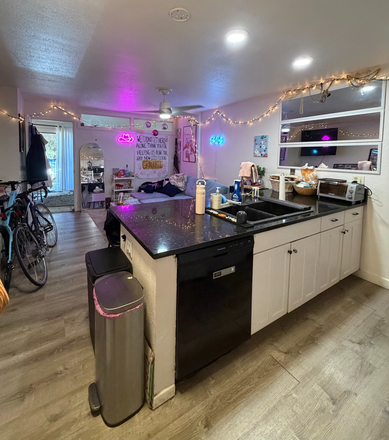 Kitchen, living room, upstairs bedroom with balcony - 1200 College Townhomes Fall Pre-lease