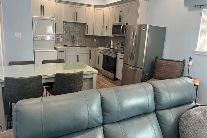 Open Concept Living Dining Area - Fully Furnished 1BR Apartment Steps to Loyola, Tulane & Freret St – All Utilities and WiFi Included!