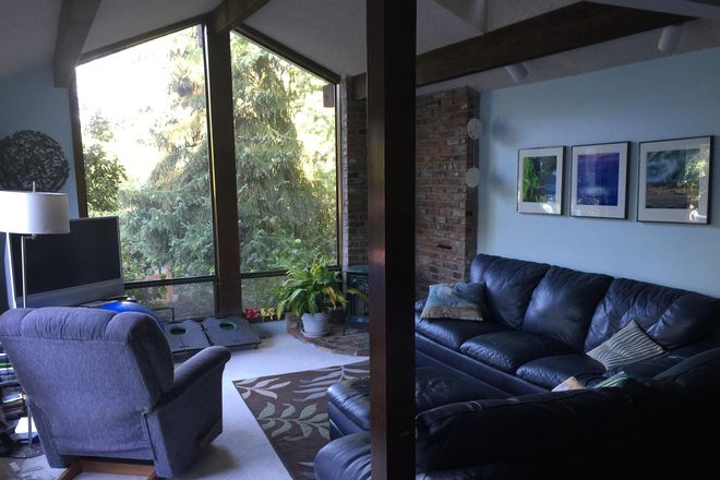 One of the living rooms. Great views! - Room for rent in quiet home to share with previous u of o faculty member and daughter.