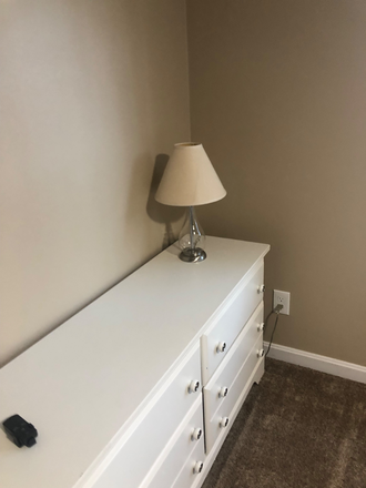 White dresser with one lamp. Remote control for ceiling fan. - Property address. 517 Benson Rd. Northbridge Massachusetts. House