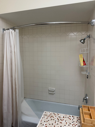Bathroom tub and shower - Fairway House