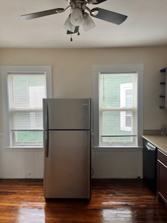 Kitchen windows - Beautiful Top Floor, Sunny 3 Bedroom apartment shuttle bus to UMB