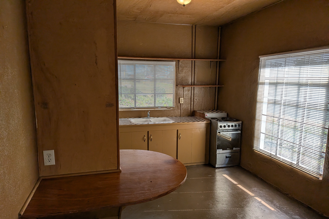 Kitchen from living room - breakfast bar - Intown Dahlonega - Walk/Bike to Campus - Unique 1BR/1BA Apartment