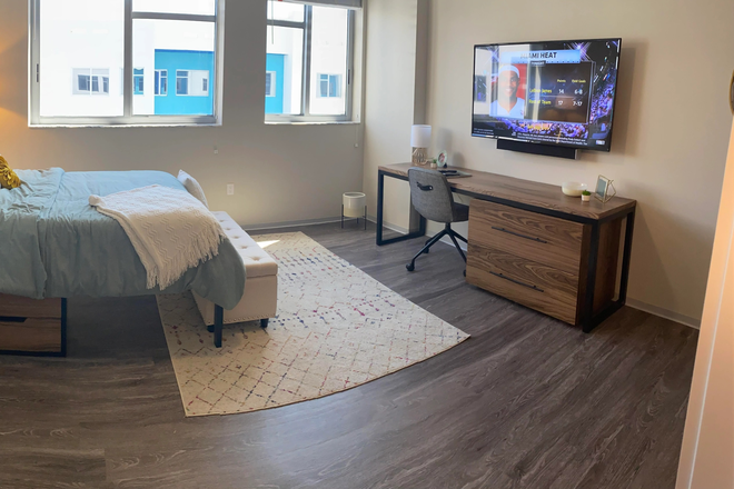 Full size bed, dressers, desk, chair, tv - Studio Apartment at Identity