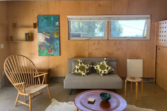 Living room - Modern solar-powered studio with views for the Bay Bridge---nice walk to campus