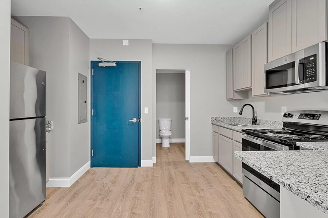 Entrance view - 109 W Lexington Apartments, modern, downtown, great transportation options