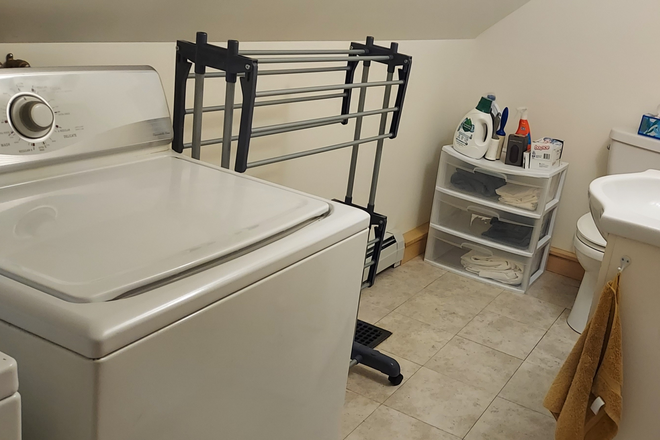 upstairs 1/2 bath with laundry - Lovingly Cared for Cape Along First Branch of The White River House