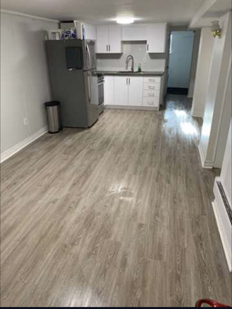 Living and kitchen area - Charming 3 Bdrm Bsmnt in the Heart of Kensington Market Triplex