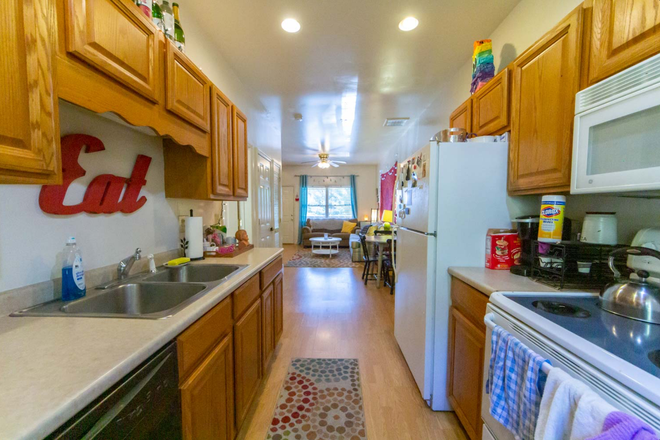 Kitchen (not our furniture, but the same floor plan). - Room for rent at Ridgeview Townhomes