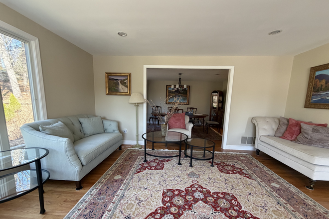 Living room leading into dining room - Spacious 3BR home 20 min from Cambridge