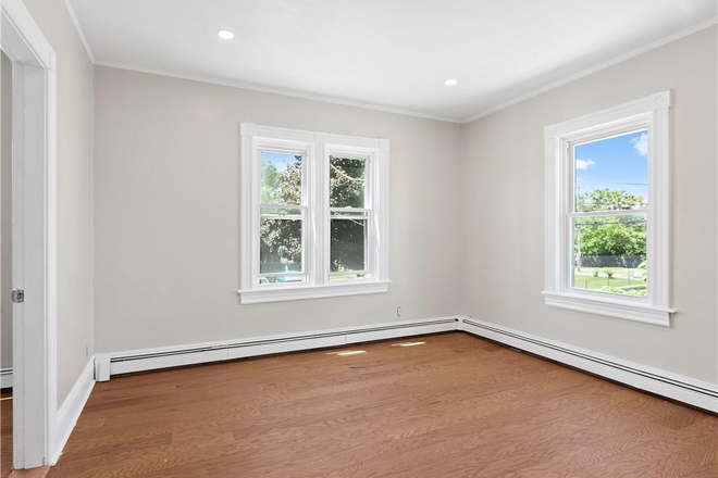 Living Room - Affordable 3 Bedroom in a Peaceful Neighborhood, 4 Miles to Brown, Covered Off Street Parking Apartments