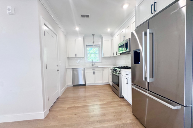 Kitchen - 4 Bed 2 bath recently renovated! Central air laundry in unit Apartments