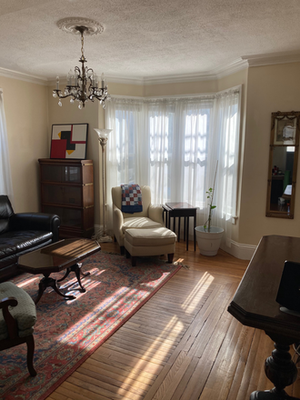 living room - eastside 2 bedroom, freshly painted, central air, 2 car parking in back Apartments