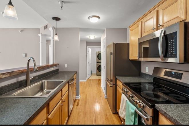 Kitchen to Laundry Room - 99 Eldredge St #206 South Burlington, VT 05403 Apartments