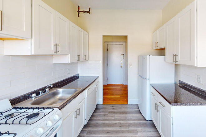 Visit hubrealtyproperties.com - Newly renovated one bedroom split, large kitchen with dishwasher Apartments