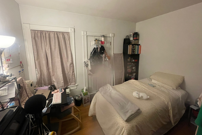 Bedroom for rent, a blur on camera lens so please ignore! Backdoor leads to outdoor exit and laundry in basement. - Single Unit Apartment First Floor
