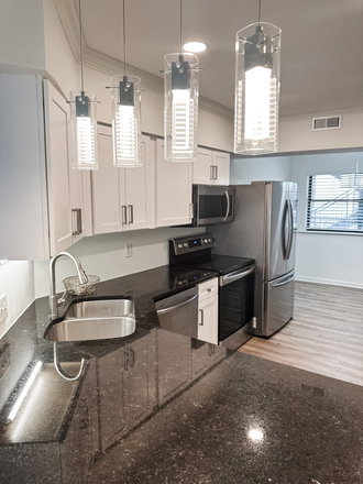 Beautiful lighting over bar top - Condo for rent, walking distance to campus. Beautiful 3BRM, 2 Bath with large living area.