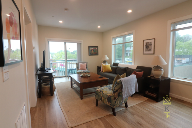 living room - Brighton New Construction with AC, parking, and in unit laundry