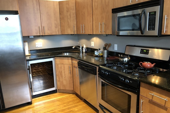 LIVING - 2 BED/2 BATH WITH HOT WATER INCLUDED AND LAUNDRY IN UNIT! 8/1/25!