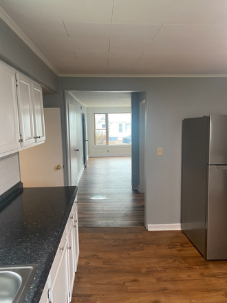 Kitchen into Living View - Freshly Renovated 3BR/1BA — 3 FREE Off-Street Parking — Walk to UVM Apartments
