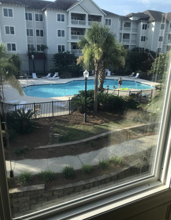 Condo overlooks the pool. - Pelican pointe villas Condo