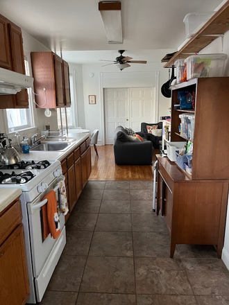 kitchen looking from back door - Charming first floor apt. in residential neighborhood, walking distance to train/Suburban Square.