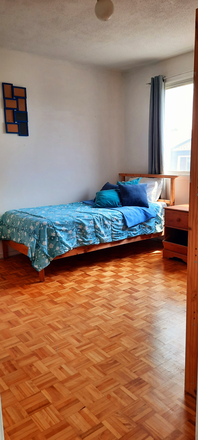 Bed - All inclusive! Sunny furnished bedroom plus kitchenette, laundry, washroom and lounge area.