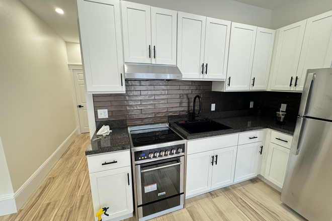 Visit hubrealtyproperties.com - Top floor roomy 2 bedroom with brand new kitchen and bathroom, new hardwood floors Apartments