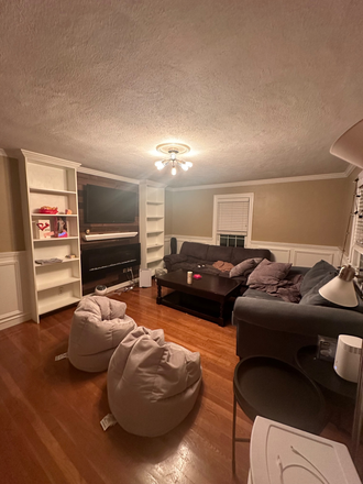 Living room with TV - Spring 2025 sublet opportunity! Large room and great location near Tufts campus! Duplex