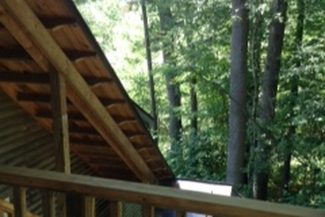 Covered, lighted stairway - Tree Top Studio Apartment