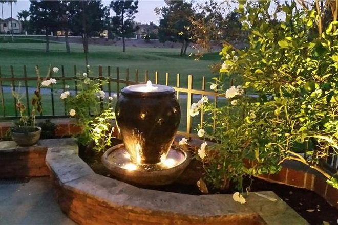 Beautiful patio includes a fireplace and work out equpment - Room for rent in a beautiful 3 brdroom Tustin condo with community pool, jacuzzi and tennis court