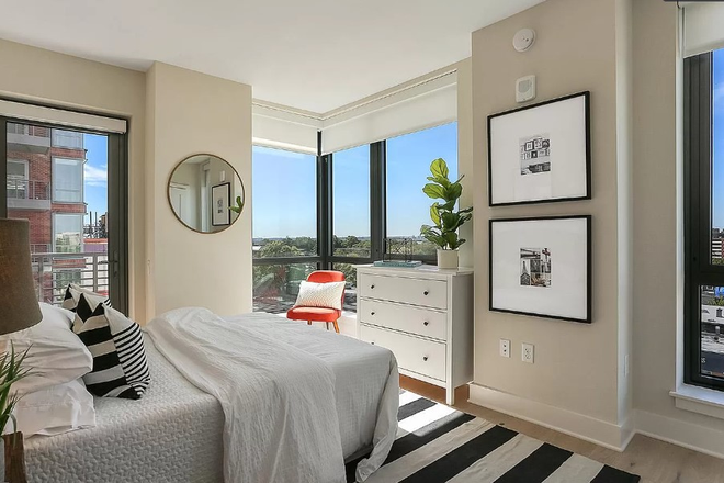 Primary Bedroom w/ balcony access - 2 Bed/2 Bath condo across from the Green Line Metro