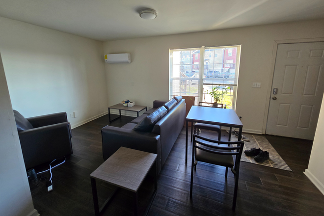 Couch, armchair, chairs, and table furnished - Redpoint Single Unit 1 Bed 1 Bath and Living Room