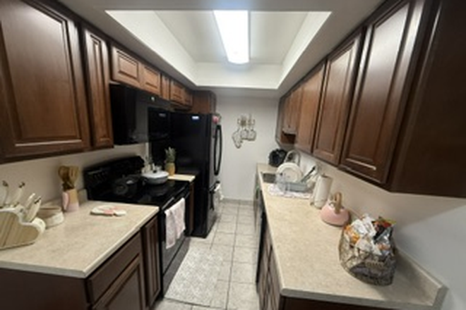 Kitchen with stove, microwave, dishwasher, and full-size refrigerator. Features spacious countertops and plenty of cabinet storage. - Cozy Private Room Near Denver – Utilities Included Condo