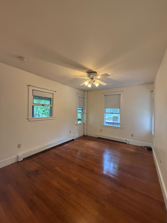Bedroom with ceiling fan - Spacious one bedroom with parking/washer dryer in unit Apartments