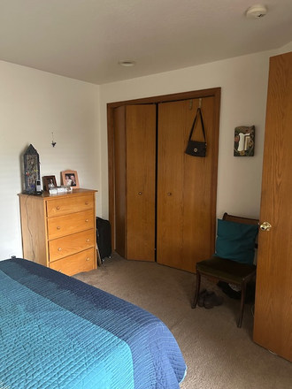 Bedroom with large closet & Dresser & chair - Quiet Room with Queen Bed, Private Bath, Kitchen & Living room use, close to bus & stores. Townhome